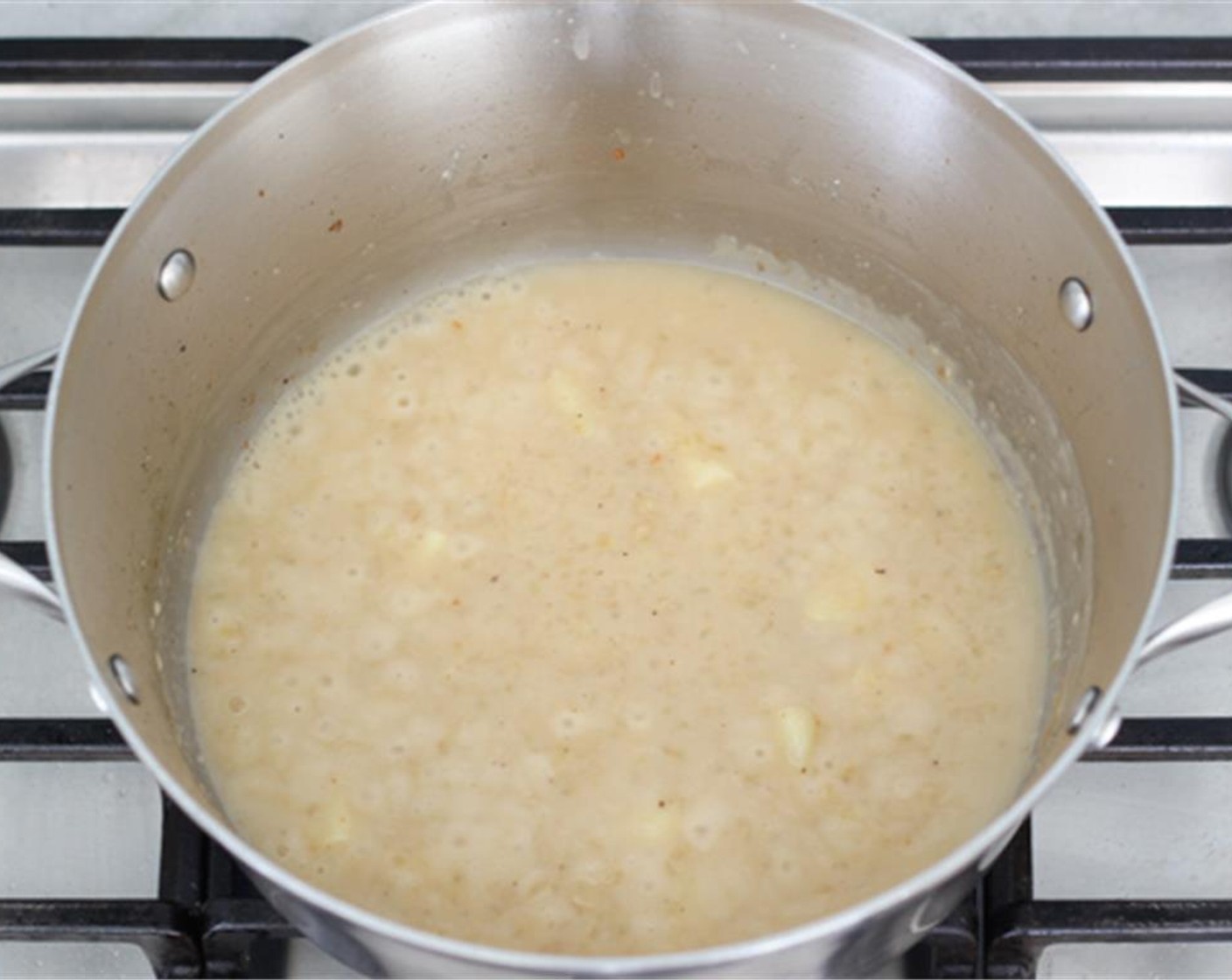 step 8 Pour in the Dry White Wine (1/2 cup) and the Chicken Broth (1 1/2 cups) gradually, whisking the liquid until the sauce is smooth. Bring to a boil and then reduce to a simmer. Pour in the Heavy Cream (1/2 cup).