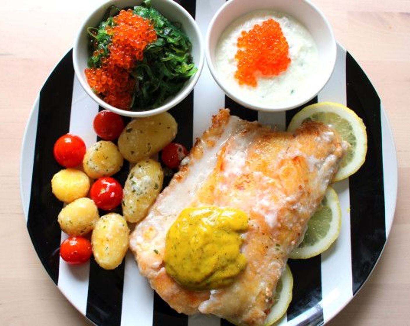 step 6 Plate fish, potatoes, and tomatoes, and top the fish with dill-mustard sauce.