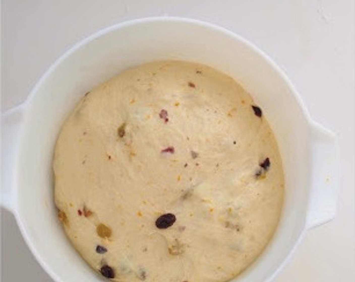 step 8 Place the dough in a large greased bowl, covered with cling film or a kitchen towel. Let it rise in a warm place for 1 hour, or until it doubles in size.