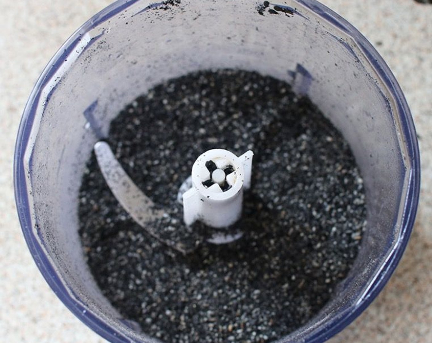 step 1 Grind the Black Sesame Seeds (1/3 cup) into a powder with a food processor or mortar and pestle.