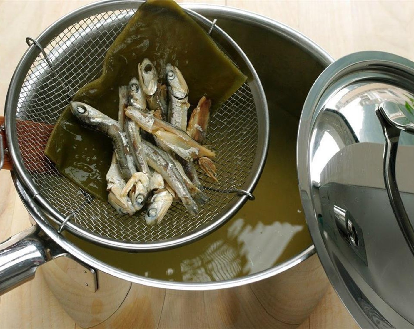 step 2 Remove from heat and set aside. The stock will get more intensified as you let it sit, about 15 minutes. At that time also remove our anchovy friends from the pot.