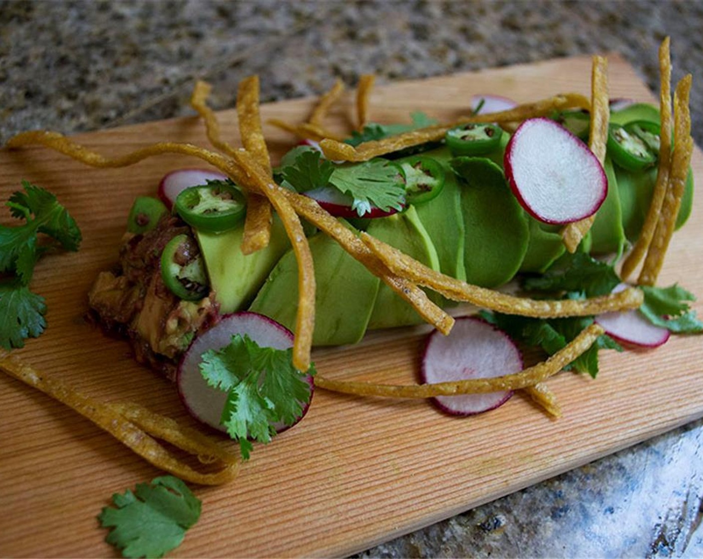 step 13 Garnish with sliced serrano chili, radishes, cilantro leaves, and tortilla strips.