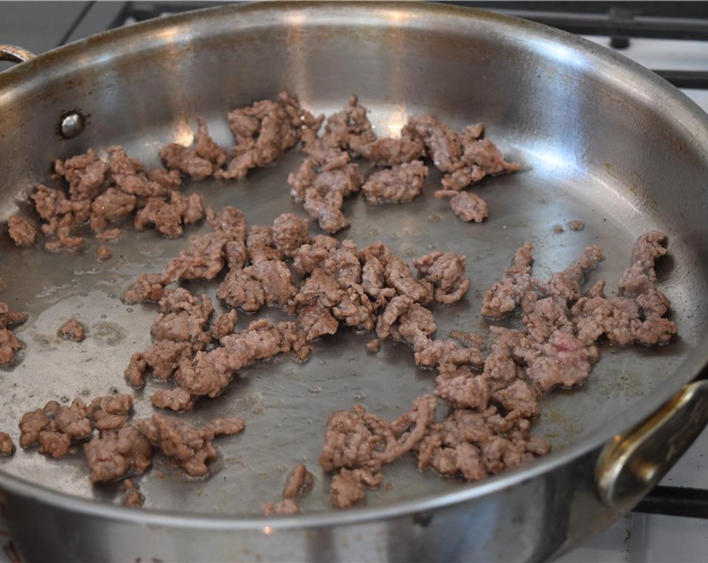 step 6 Brown the Lamb (8 oz) over medium heat, about 3 to 5 minutes. Remove with a slotted spoon leaving behind the rendered fat.