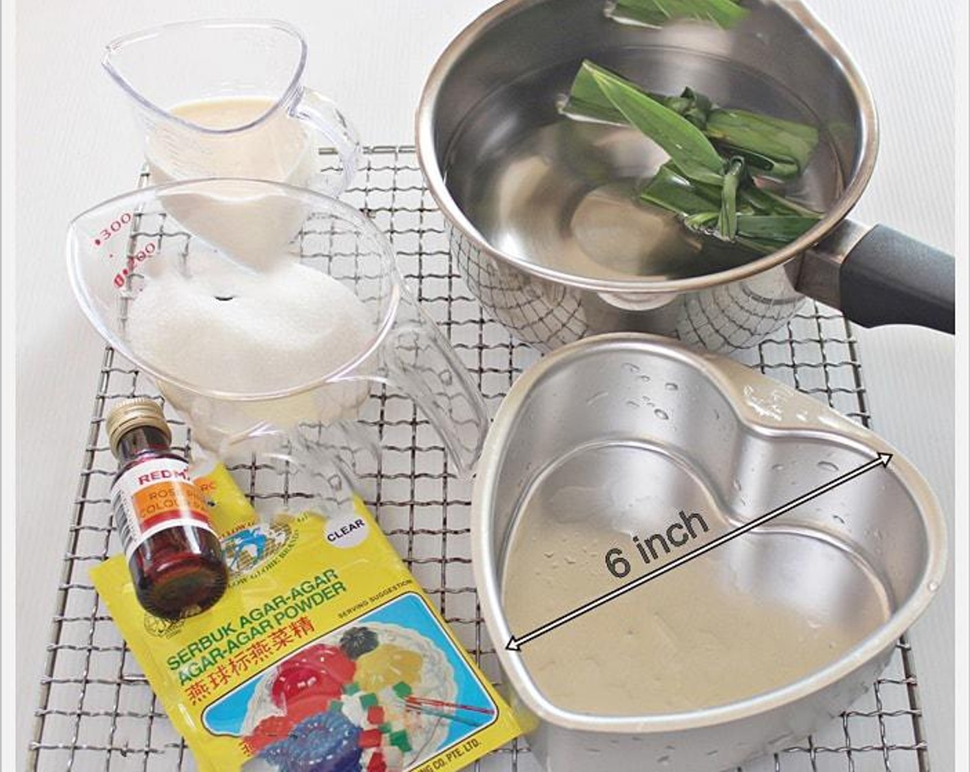 step 1 In a pot, add Water (3 1/3 cups), Granulated Sugar (3/4 cup), Agar-Agar Powder (1 Tbsp), and Pandan Leaves (2) together. Stir mixture until boiling at medium heat. Turn off heat and stir for 1 minute, discard pandan leaves.