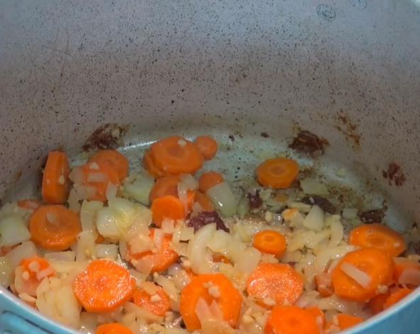 step 2 In the same saucepan, add Yellow Onion (1), Garlic (2 cloves) and Carrots (3). Cook, stirring, for a few minutes, or until the onions have softened.