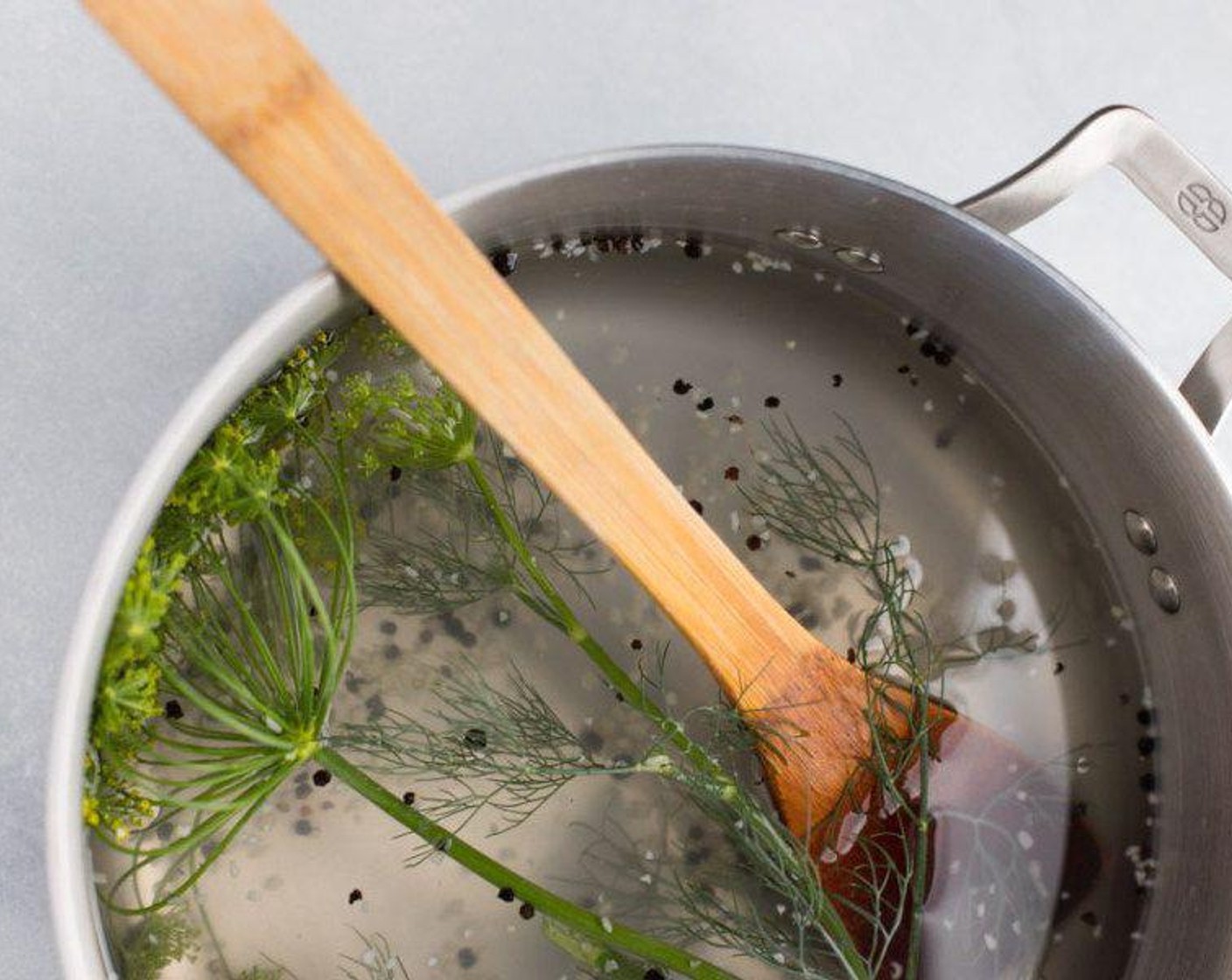step 3 Combine Water (6 cups), Distilled White Vinegar (2 cups), Granulated Sugar (1 Tbsp), Salt (1 Tbsp), Garlic (1 Tbsp), Fresh Dill (1 sprig), and Peppercorns (1 tsp) in a large pot and bring to a rolling boil. Remove from heat.