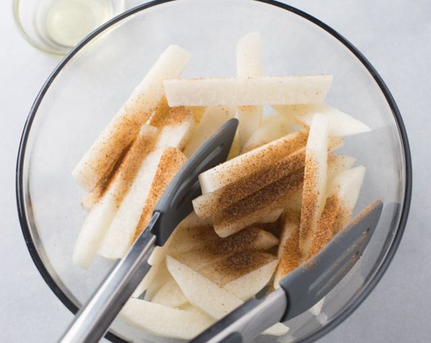 step 3 Toss fries in a bowl with the juice of the Lime (1), Creole Seasoning (1 tsp) and Olive Oil (1 Tbsp). Transfer fries to a baking sheet, discarding the excess liquid.