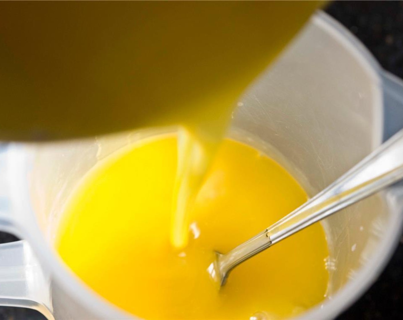 step 5 Slowly pour in the melted and cooled butter.