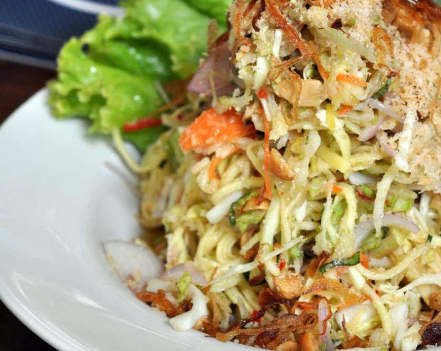 step 4 Top with Fried Onions (2 Tbsp) and a bit of coriander and serve immediately.