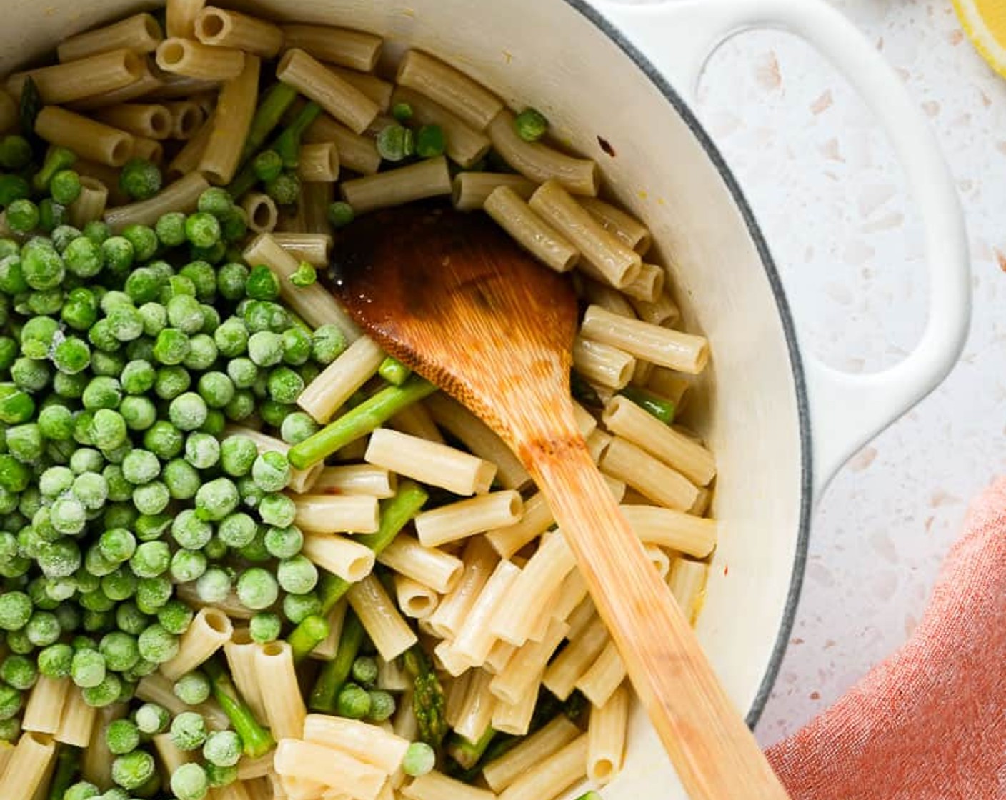 step 8 Add the asparagus and stir. Add the Frozen Green Peas (3/4 cup), cooked pasta, and another ¼ cup of reserved pasta water.