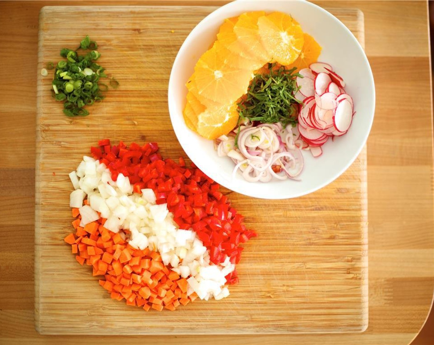 step 1 Peel Carrot (1) and Yellow Onion (1) and dice into 1/4 inch pieces; set aside. Cut Red Bell Pepper (1) in half and discard stem, seeds, and pith. Slice pepper into thin slices and set aside. Slice Shallot (1) in half lengthwise, then thinly slice across; place in medium bowl.