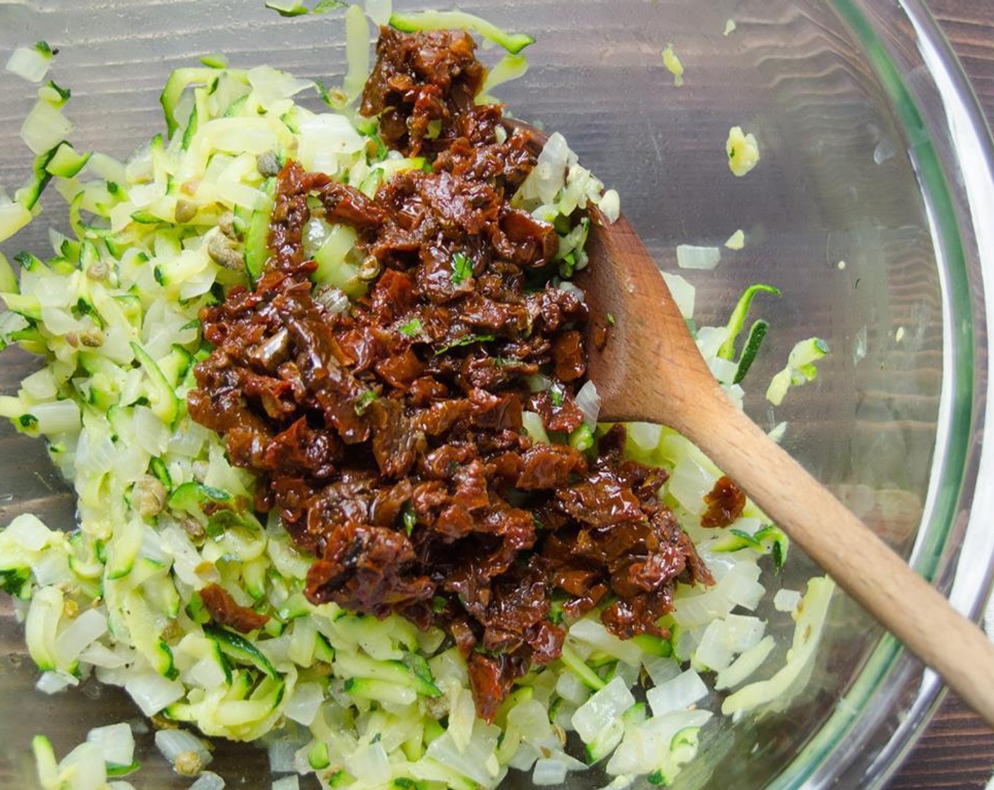 step 6 Transfer zucchini to the bowl with the onions. Add the capers and sun-dried tomatoes and stir to combine.