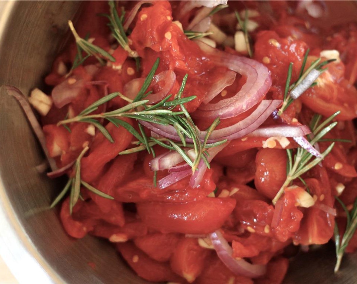 step 4 Mix red onion, garlic, stewed tomato and Fresh Rosemary (5 sprigs) together in a bowl. Dry the mixture by squeezing and pouring off any extra liquid.