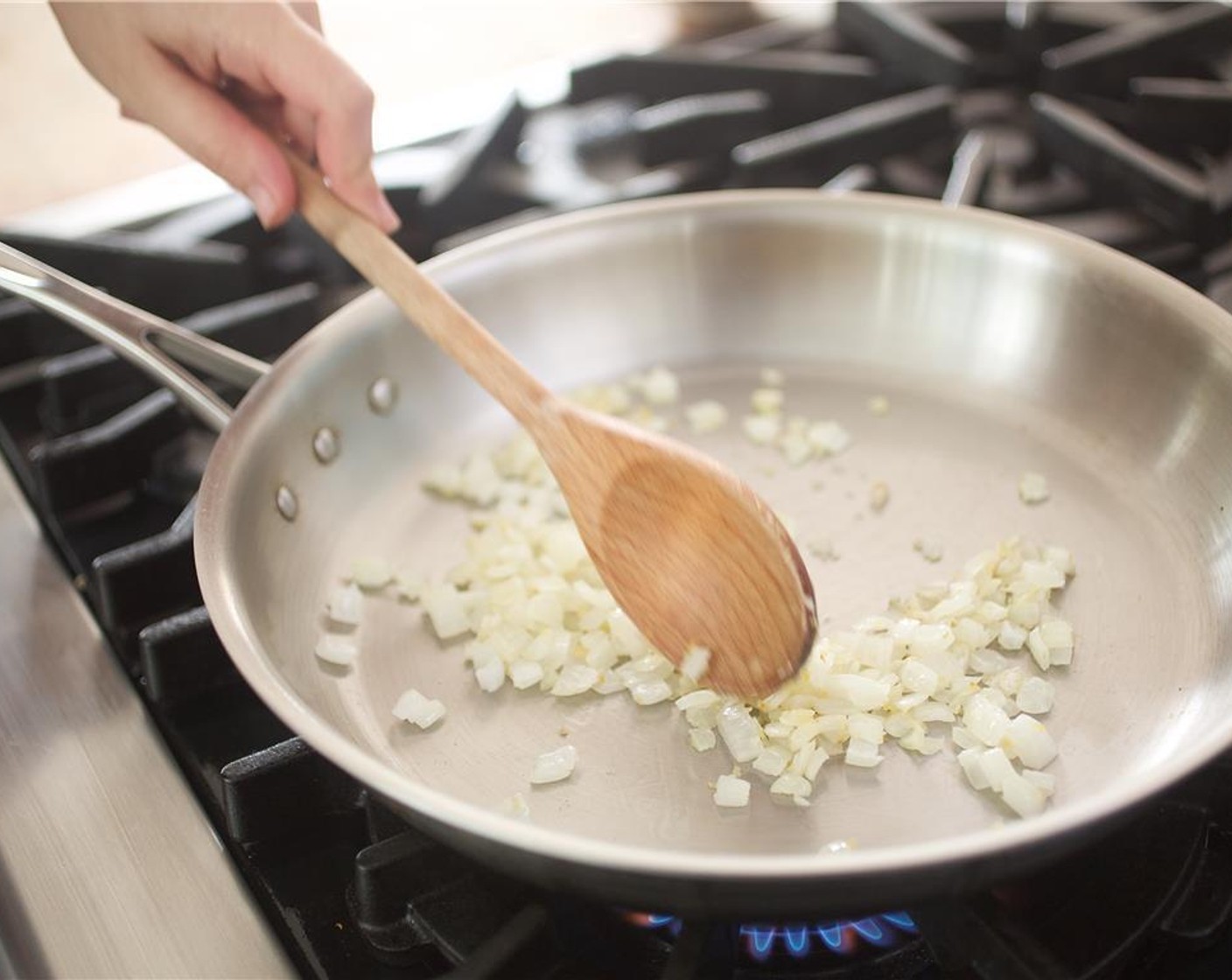 step 5 Once cooked, remove chicken from the pan and set aside. In the same pan, add 1/2 tablespoon of olive oil over medium-high heat. Add onion and saute for 2 minutes until translucent.