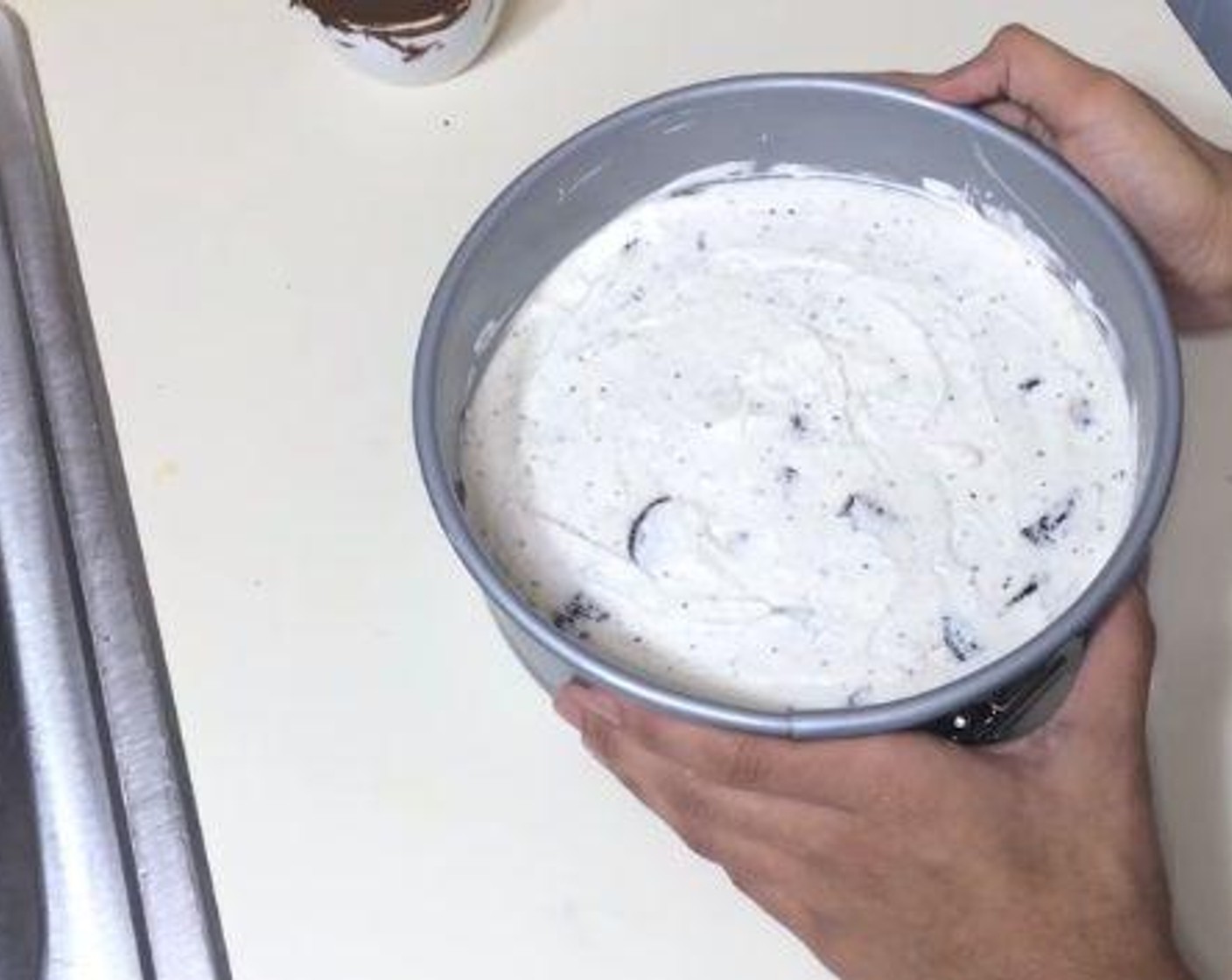 step 4 Pour the cream-oreo mixture over the crust. Chill it in the fridge.