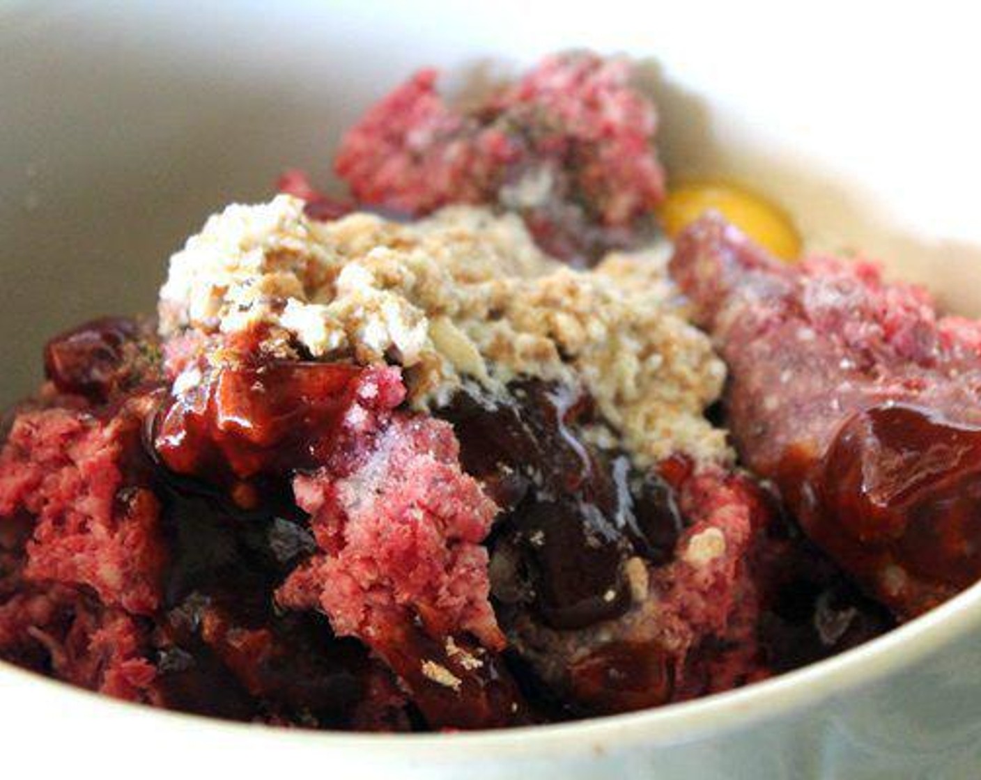 step 4 In a large bowl, combine the Ground Beef (2 lb), crumb and milk mixture, Egg (1), Garlic (1/2 Tbsp), Salt (1/2 tsp), Ground Black Pepper (1/2 tsp) and half of the Barbecue Sauce (1/4 cup). With your hands, mix the meatballs until combined.