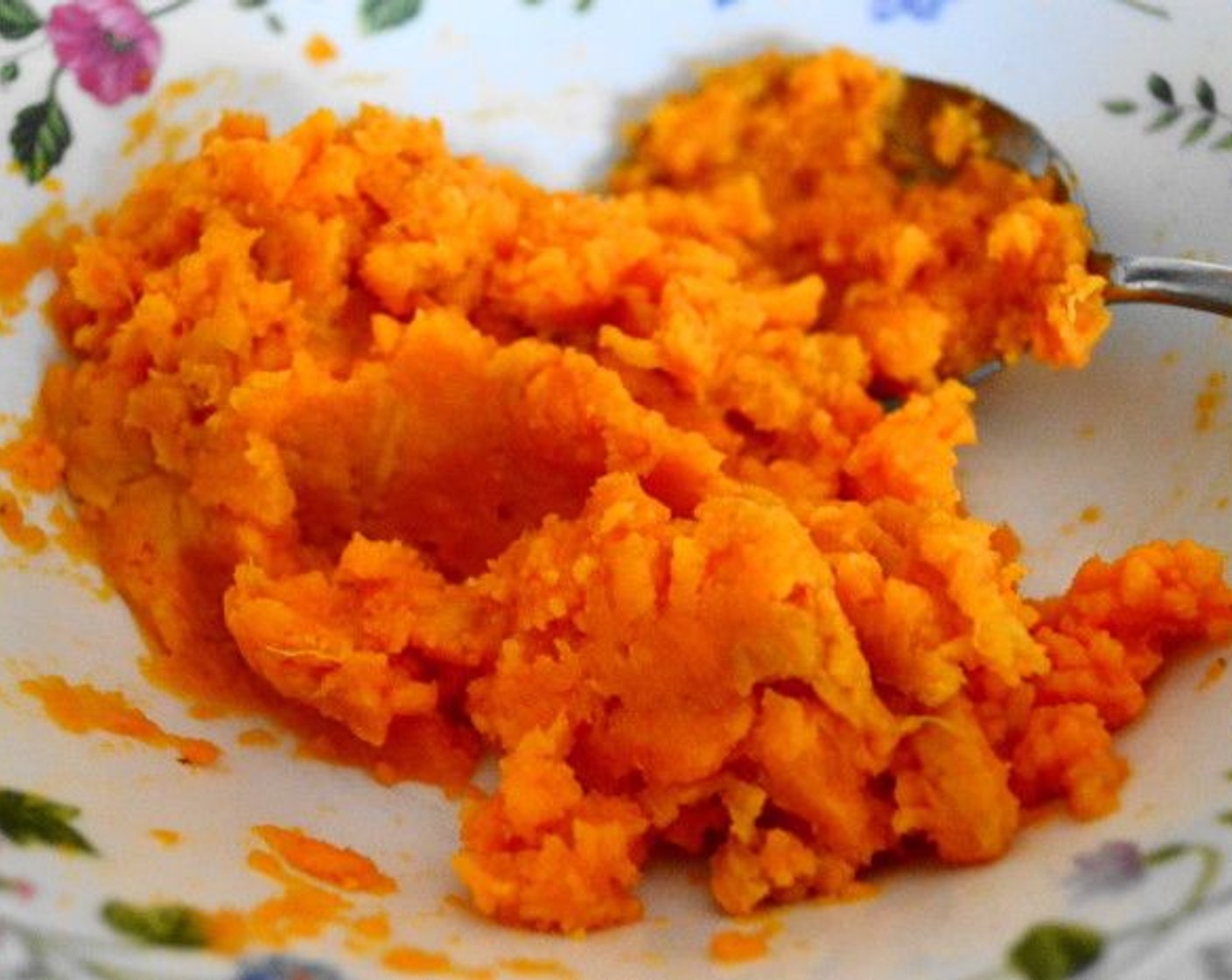 step 2 When it is cool enough to handle, cut the sweet potato in half and scoop the flesh right out of the skin into a bowl. Add the Maple Syrup (1/2 tsp) into the bowl and mash it all together well until smooth. Set the bowl aside so the sweet potato can cool completely.