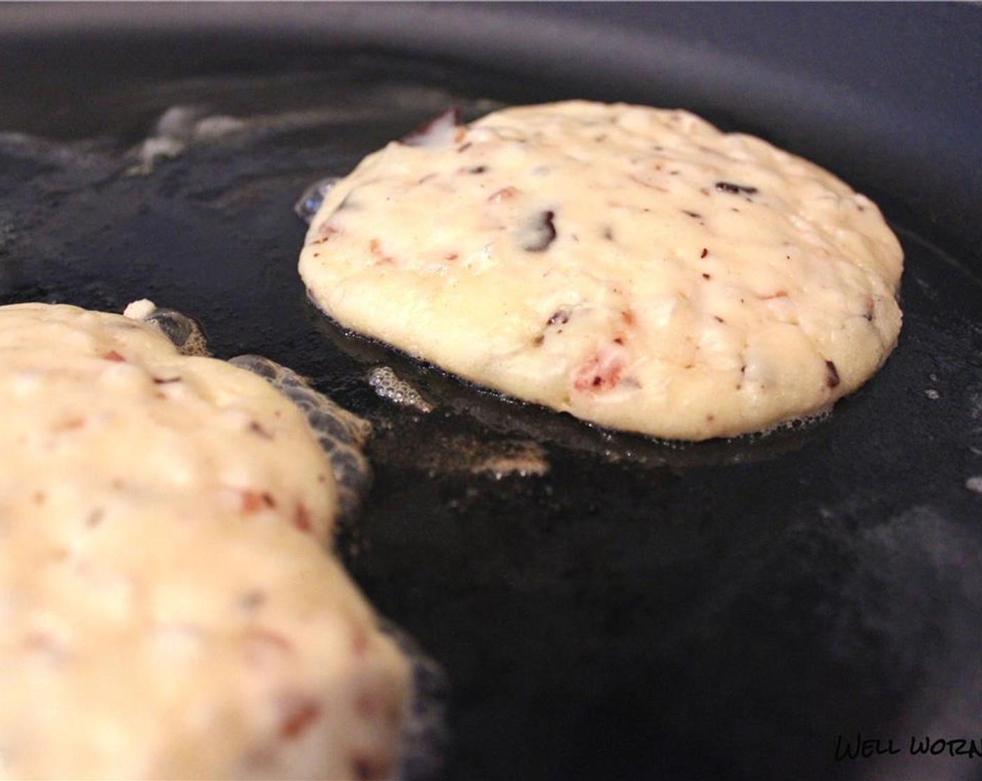 step 5 Heat a griddle or cast iron pan to medium high heat and add some butter to coat the surface. Pour two heaping tablespoons of batter onto the griddle for each pancake.