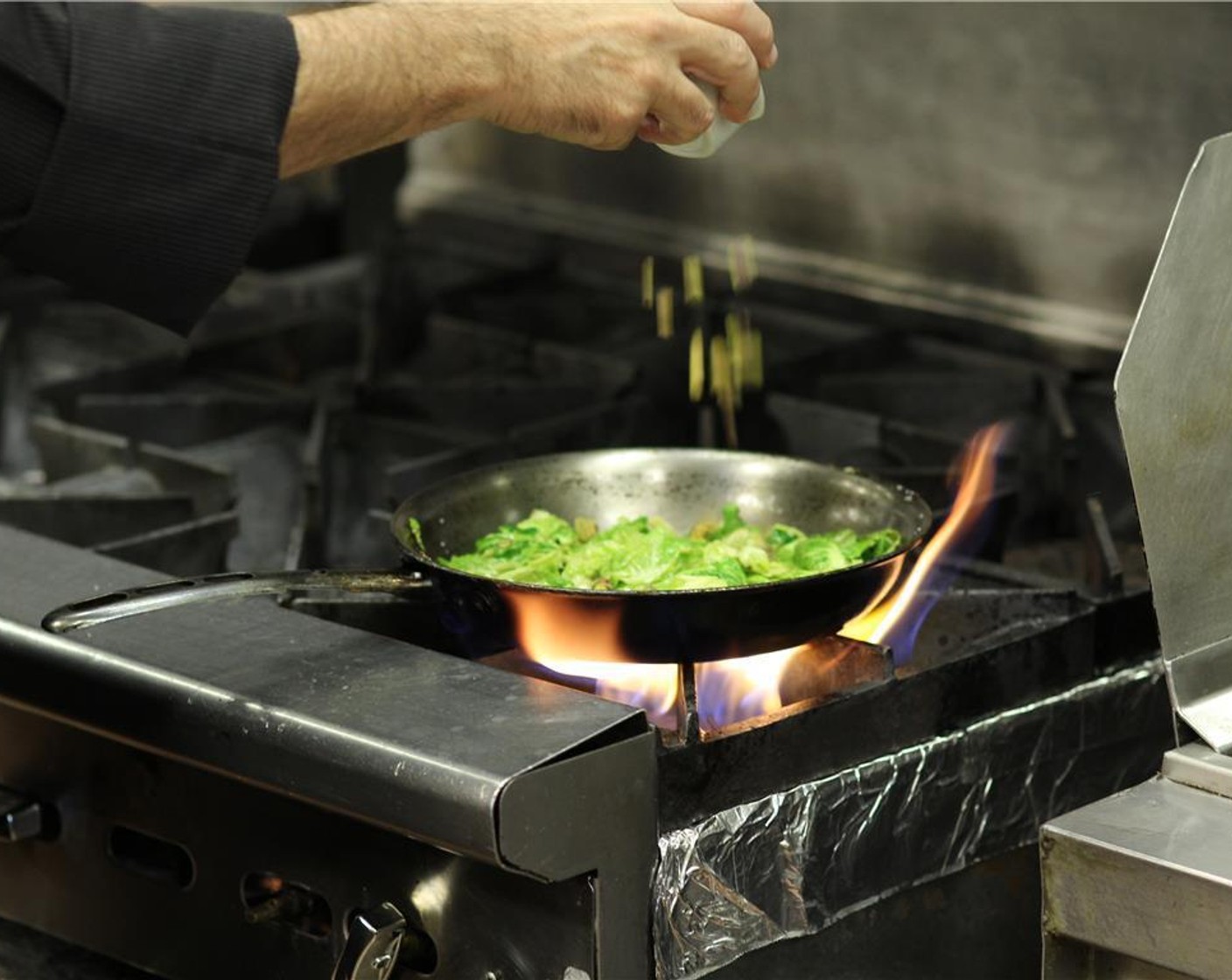 step 3 In a saute pan over medium heat, add the Olive Oil (1 fl oz), brussels sprouts, chopped pistachios, Kosher Salt (1/4 tsp) and Ground Black Pepper (1 pinch). Saute until leaves begin to soften but are still bright green, about 2 minutes.