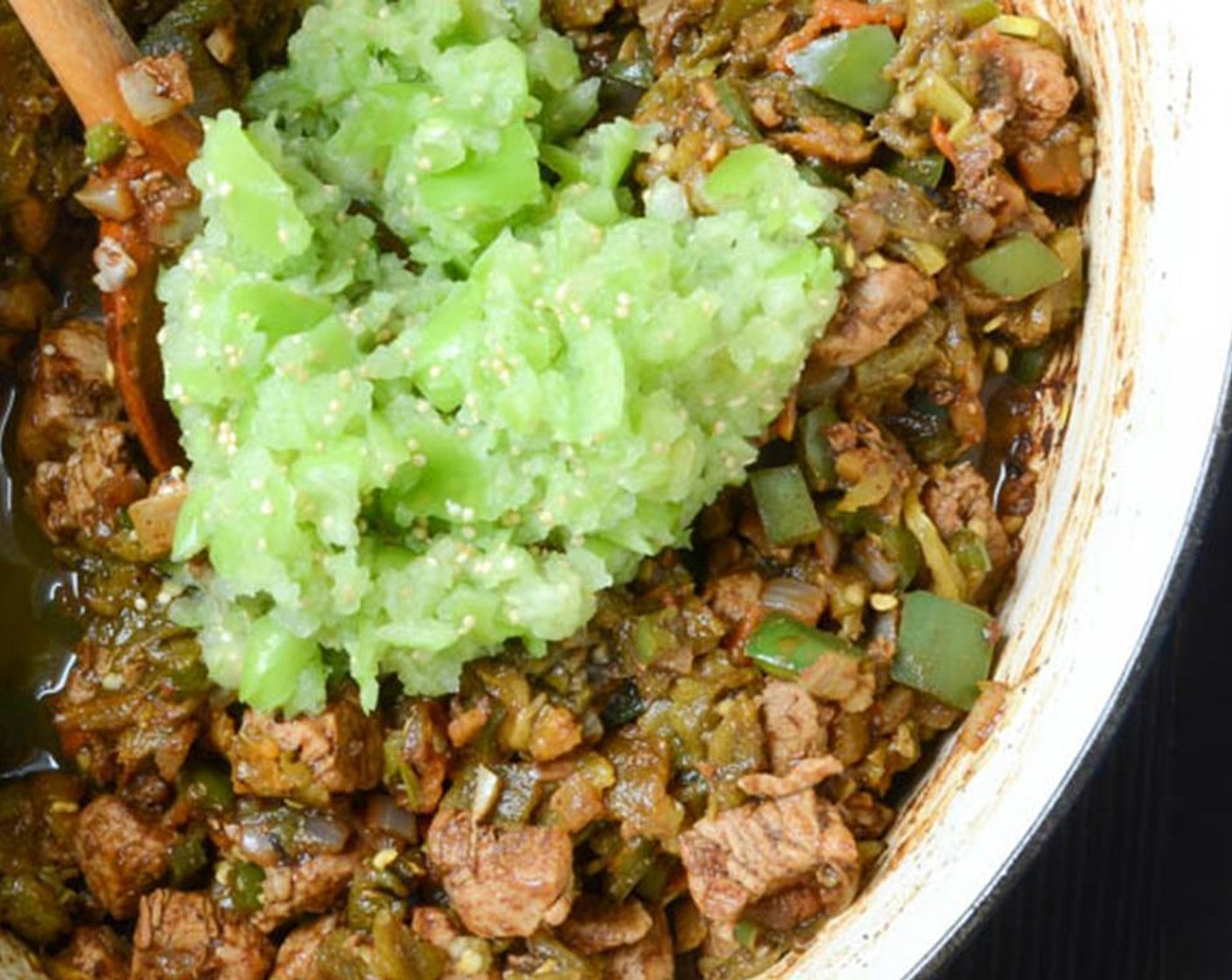 step 7 Stir in the the chopped chilies, tomatillos and Low-Sodium Chicken Broth (2 cups).