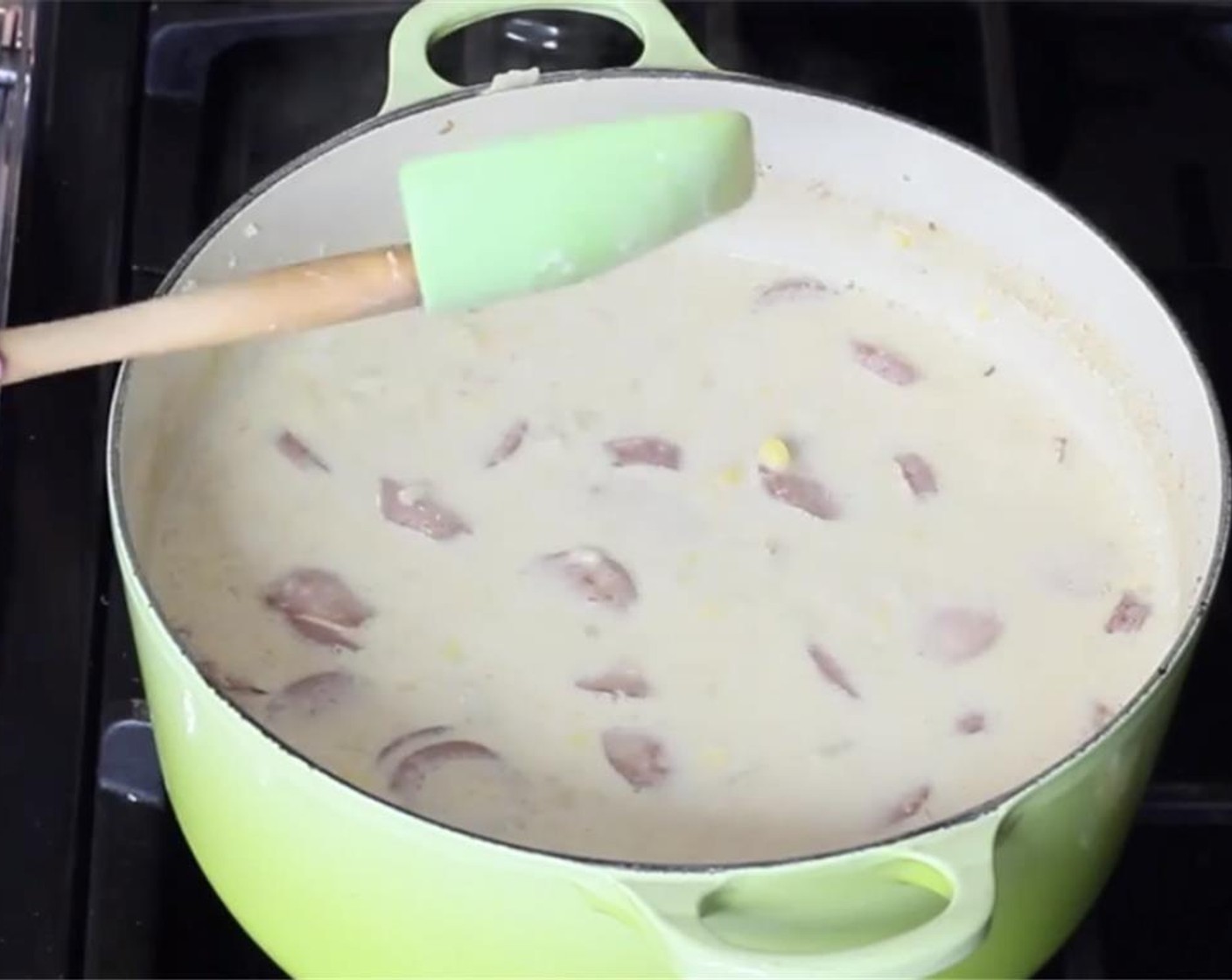 step 11 With a wooden spoon or utencil, mash some of the cooked potatoes to add extra thickness to the soup.