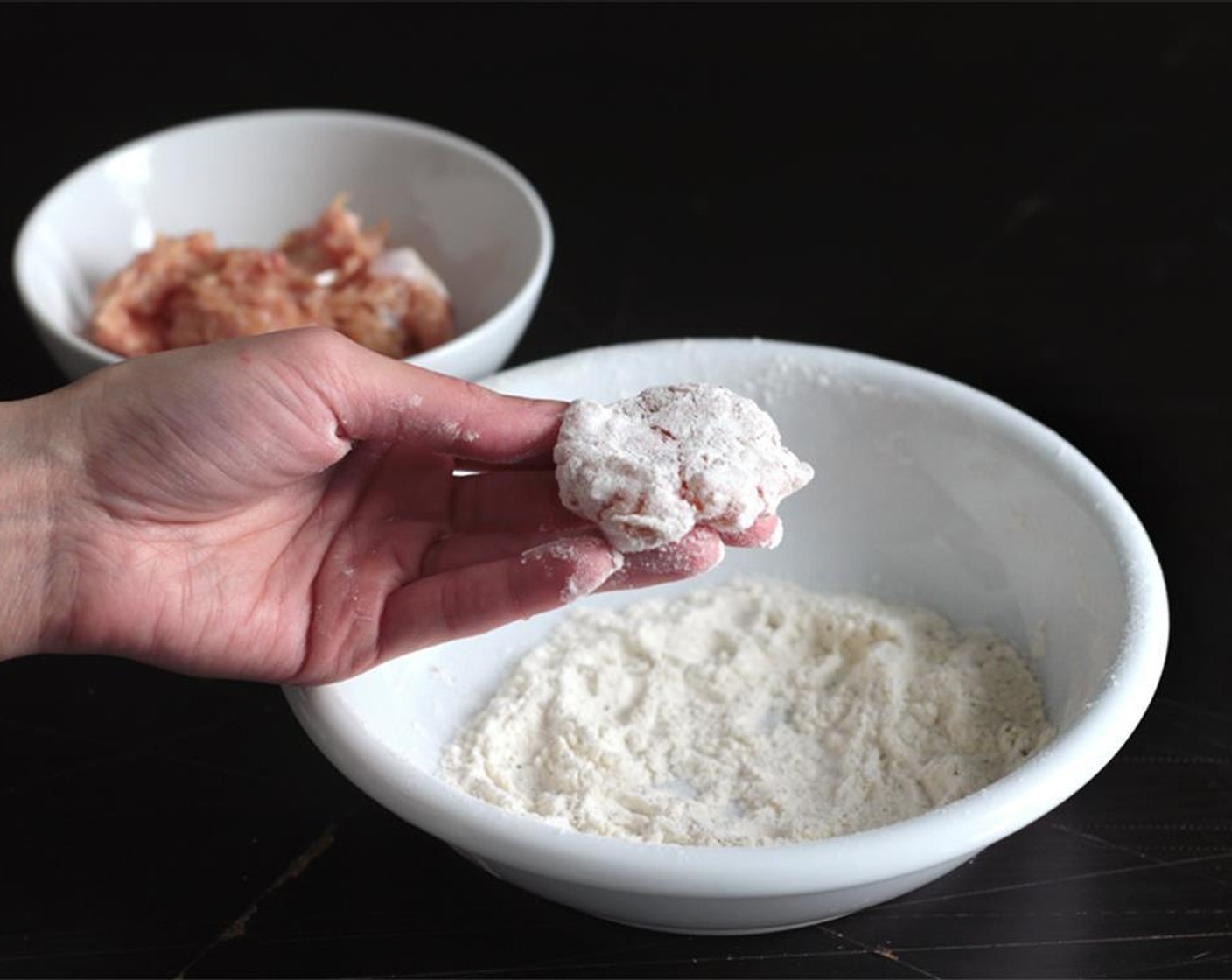 step 3 Evenly whisk together All-Purpose Flour (1/2 cup), Salt (1/2 tsp), and Ground Black Pepper (1/2 tsp) in a shallow bowl.  Prepare a couple of baking sheets that are lightly dusted with flour.