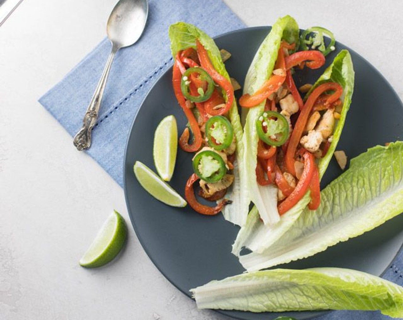 step 5 Combine the peppers with the chicken mixture in your pan and heat until all warm, 1-2 minutes. Fill leaves of Romaine Lettuce (1 head) and serve with wedges of Lime (1) and Jalapeño Pepper (1).