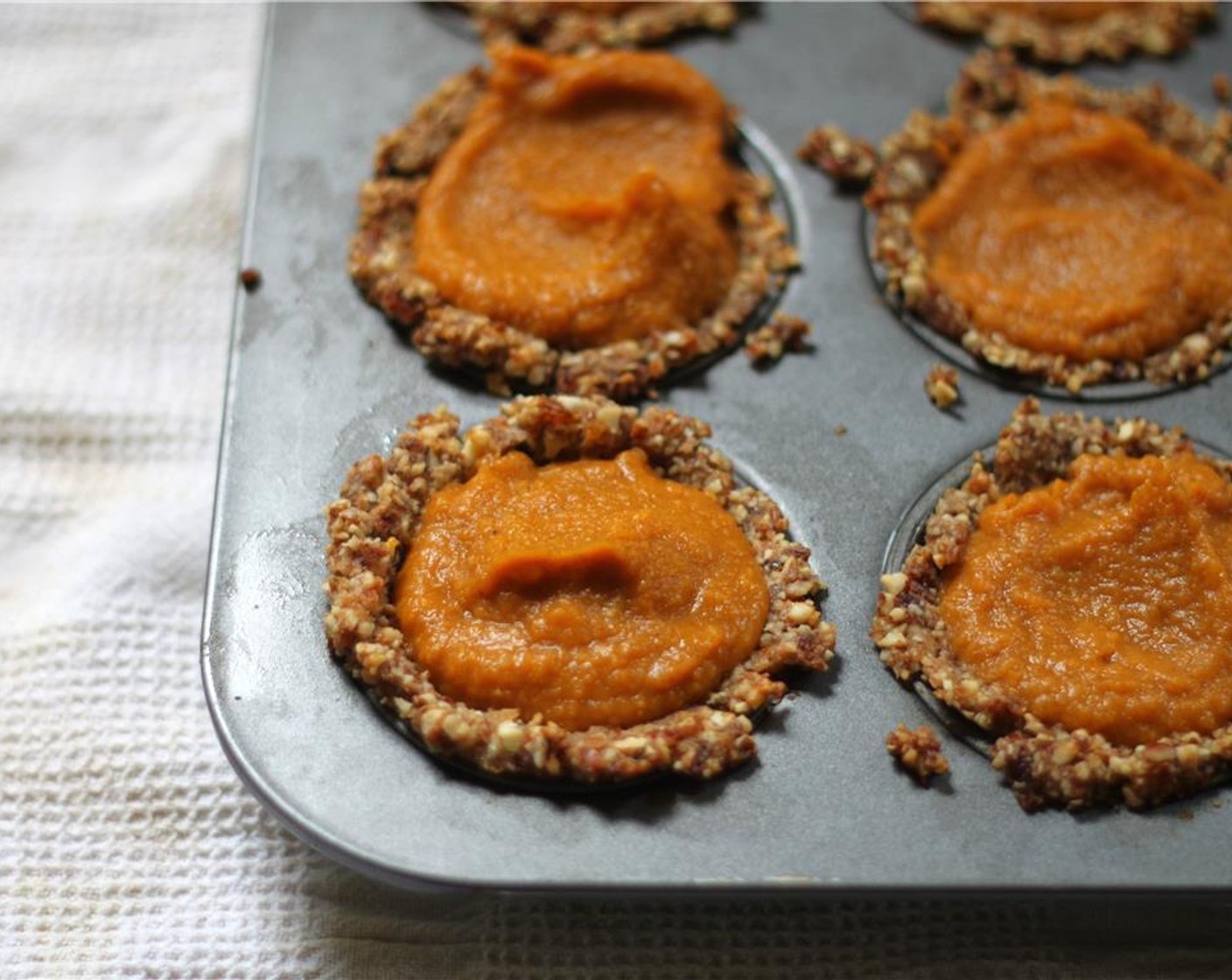 step 11 Fill each cup of nut crust with sweet potato, and return to the oven to bake for another 15 minutes.  The filling will remain soft.