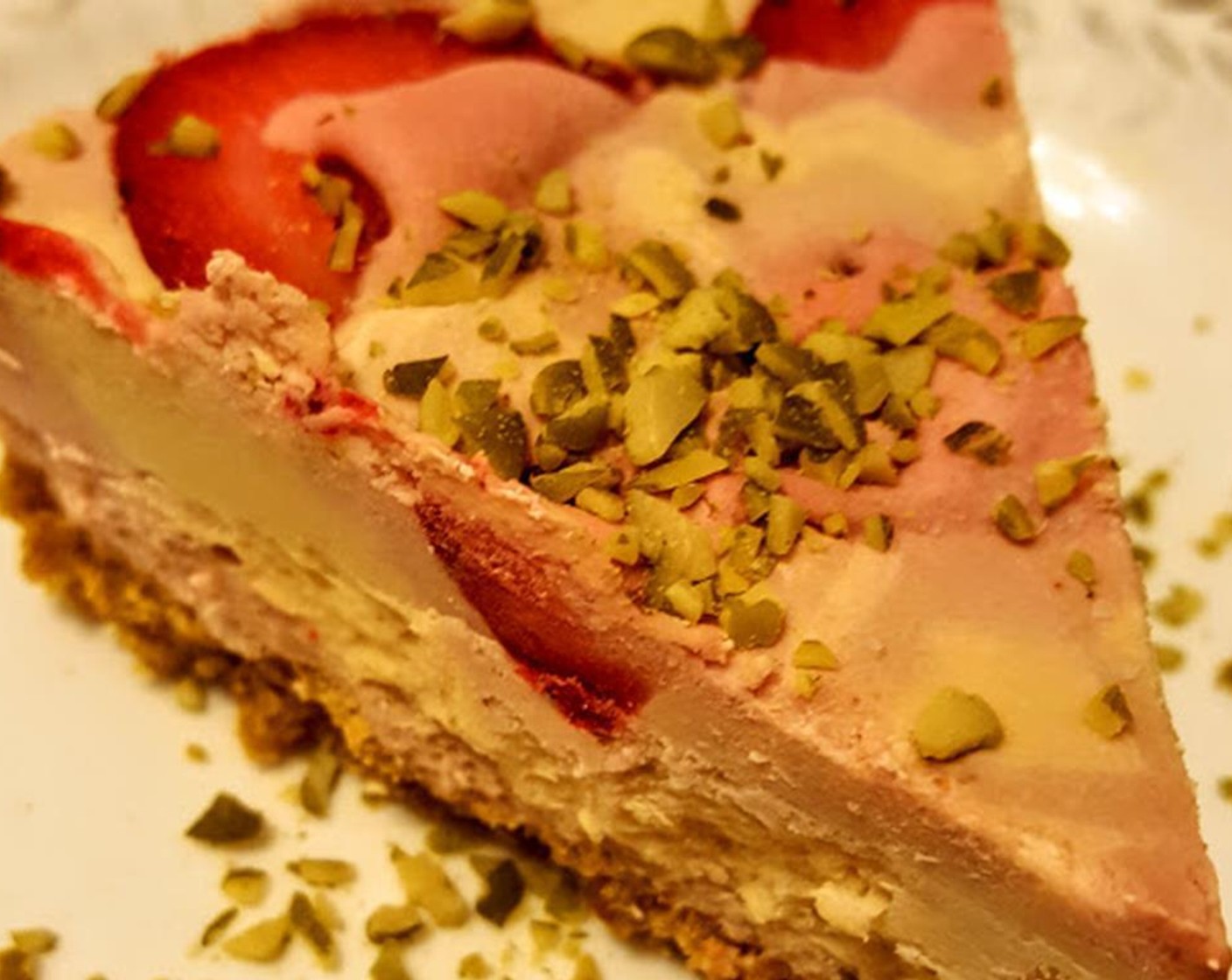 step 7 Cut with a sharp knife. Serve garnished with more berries and pistachios if desired. Enjoy!
