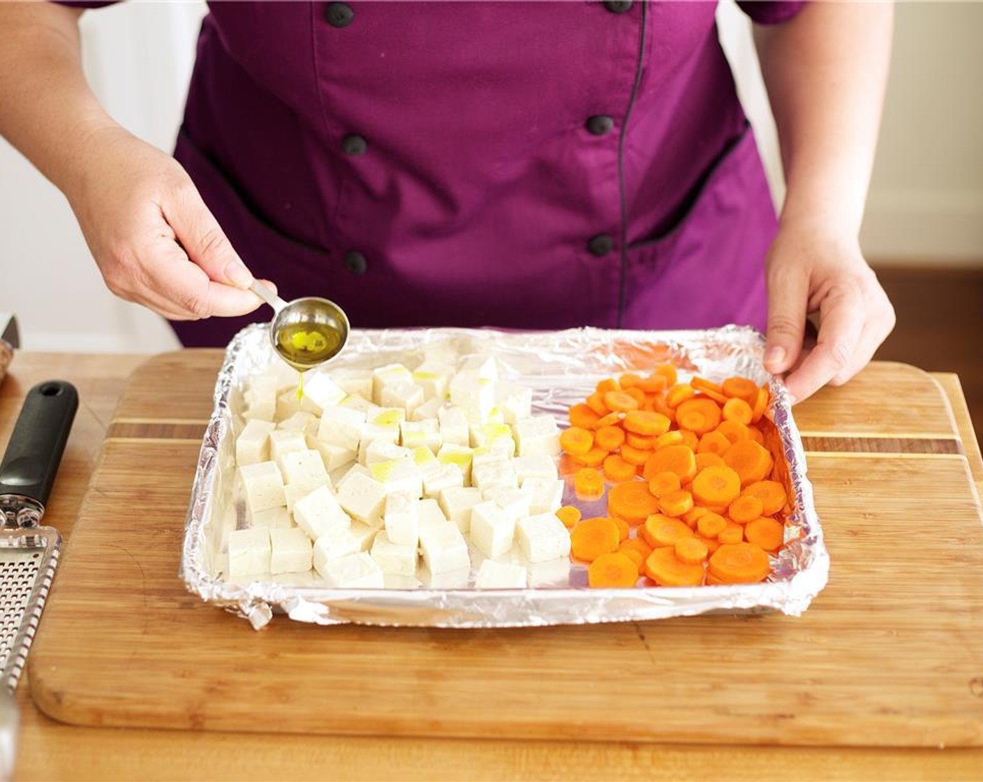 step 3 Season tofu and carrots with Olive Oil (1 Tbsp) and Salt (1 tsp). Toss evenly and lay carrots and tofu in a single layer. Roast in the oven for sixteen minutes until carrots are just tender and tofu is slightly golden. Remove from oven and hold.