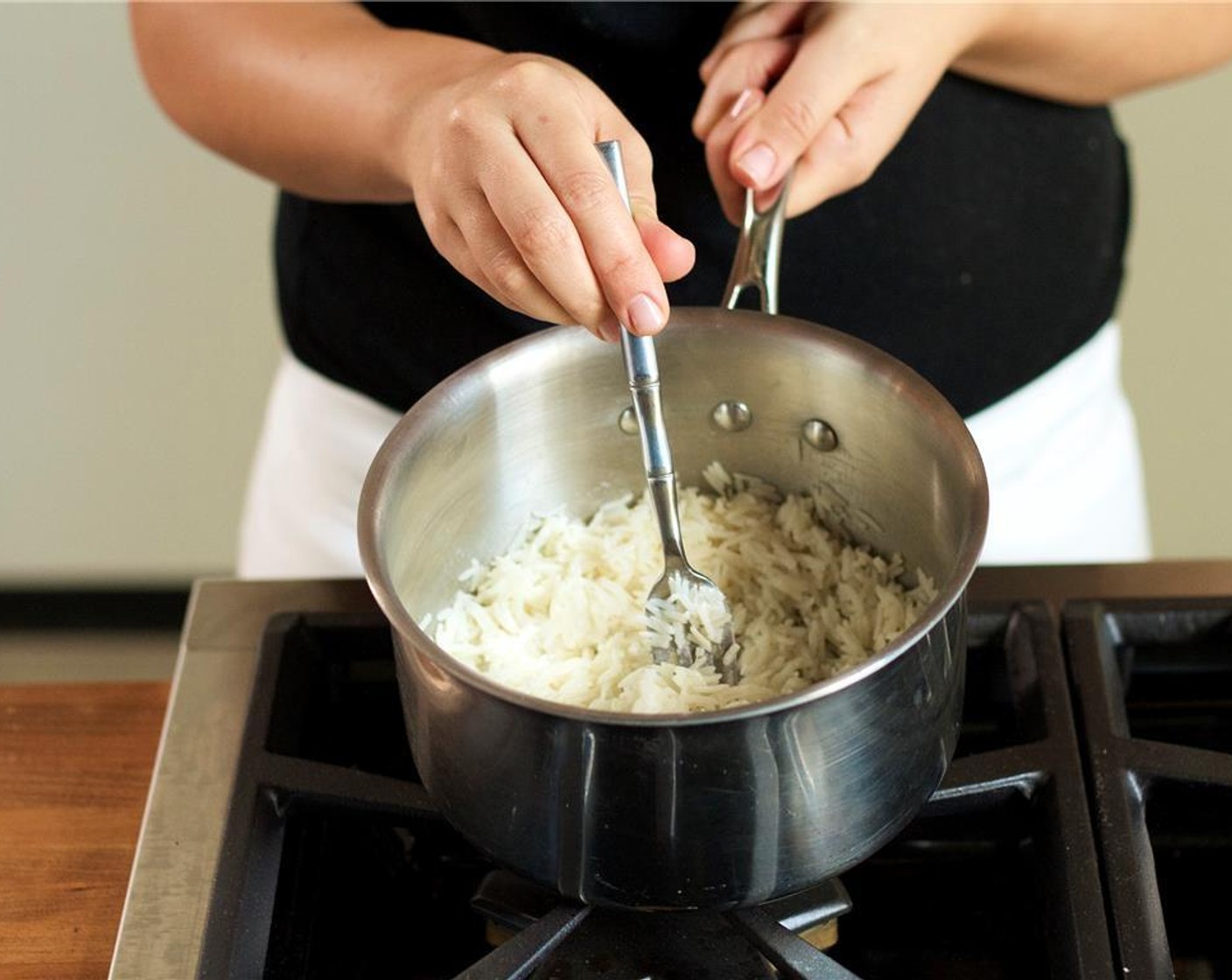 step 8 Increase heat to high and bring to a boil. Once the rice has reached a boil, reduce the heat back to medium and cover with a lid. Simmer for 20 minutes or until rice is cooked. Fluff with a fork and keep warm.
