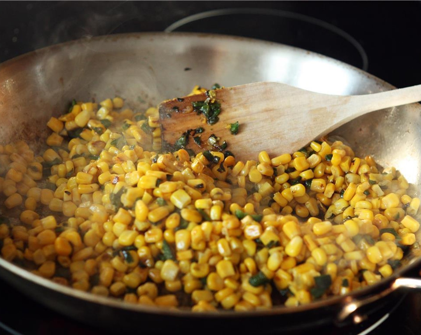 step 2 Add Sweet Corn (2 cans) and sauté for another 5-10 minutes, stirring occasionally. For the last 3 minutes, turn the heat up to medium-high to allow the corn to char, stirring occasionally. Remove from heat and transfer corn mixture to a mixing bowl.