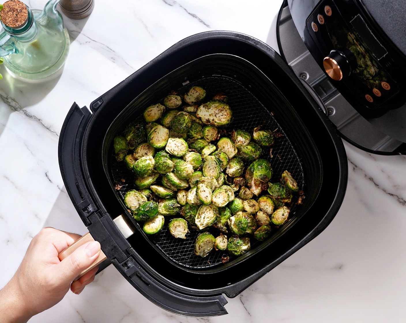 step 2 Place the brussels sprouts in the air-fryer basket and air fry at 350 degrees F (180 degrees C) for 6-8 minutes. You may need to cook them in batches if they don't all fit.