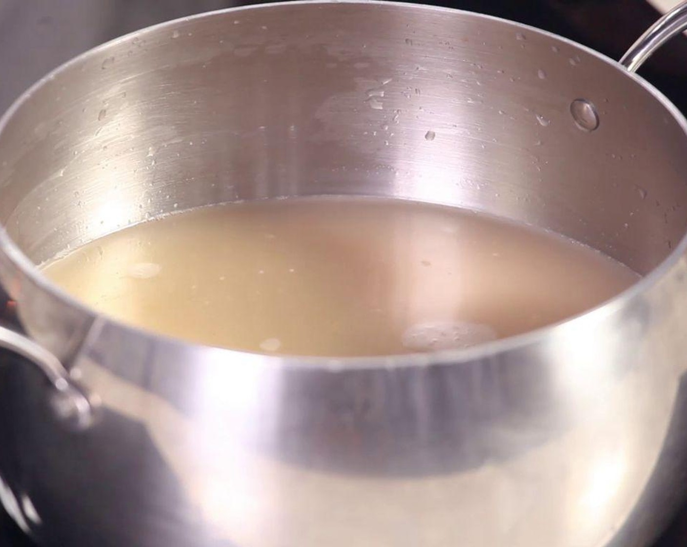 step 2 Put the ground shrimp into the pan. Crack an Eggland's Best Classic Egg (1) and add Water (6 1/4 cups), beat the mixture well, then turn on the hob.