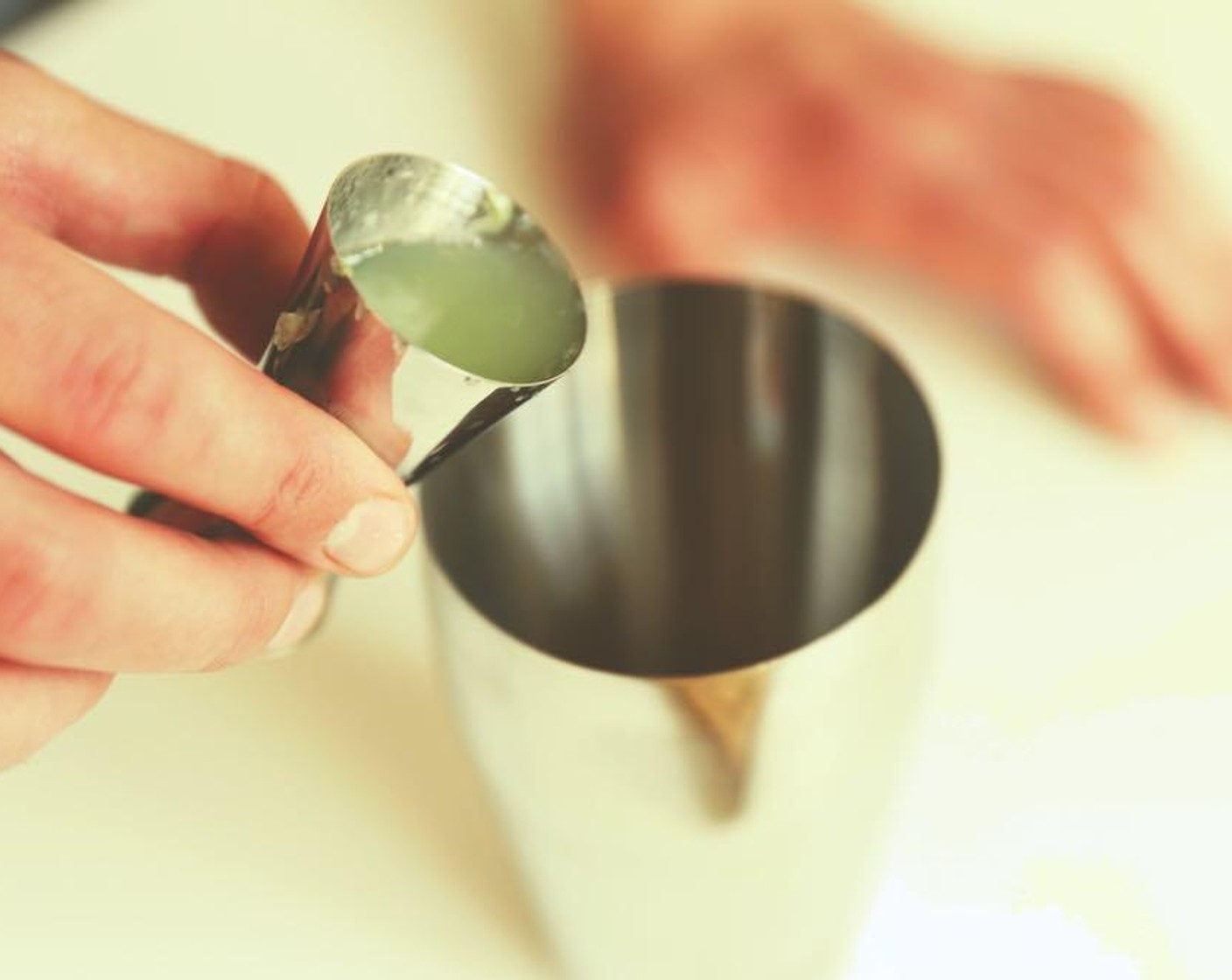 step 4 Add the lime juice to the shaker.