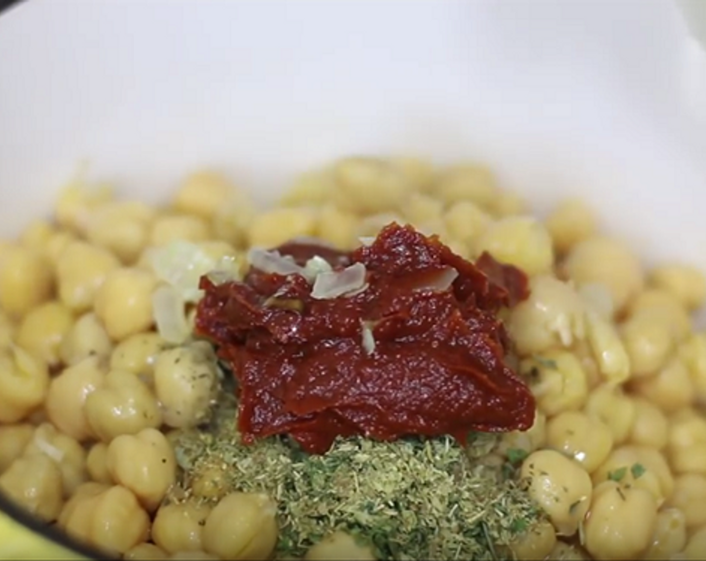 step 2 Mix in Garlic (2 cloves), saute for 30 seconds, then add Green Bell Peppers (4 Tbsp), Tomatoes (2), Carrot (1/2 cup), Chickpeas (2 cans), Dried Basil (1/2 tsp),  Dried Parsley (1 tsp), Dried Oregano (1/2 tsp), and Tomato Paste (2 Tbsp).