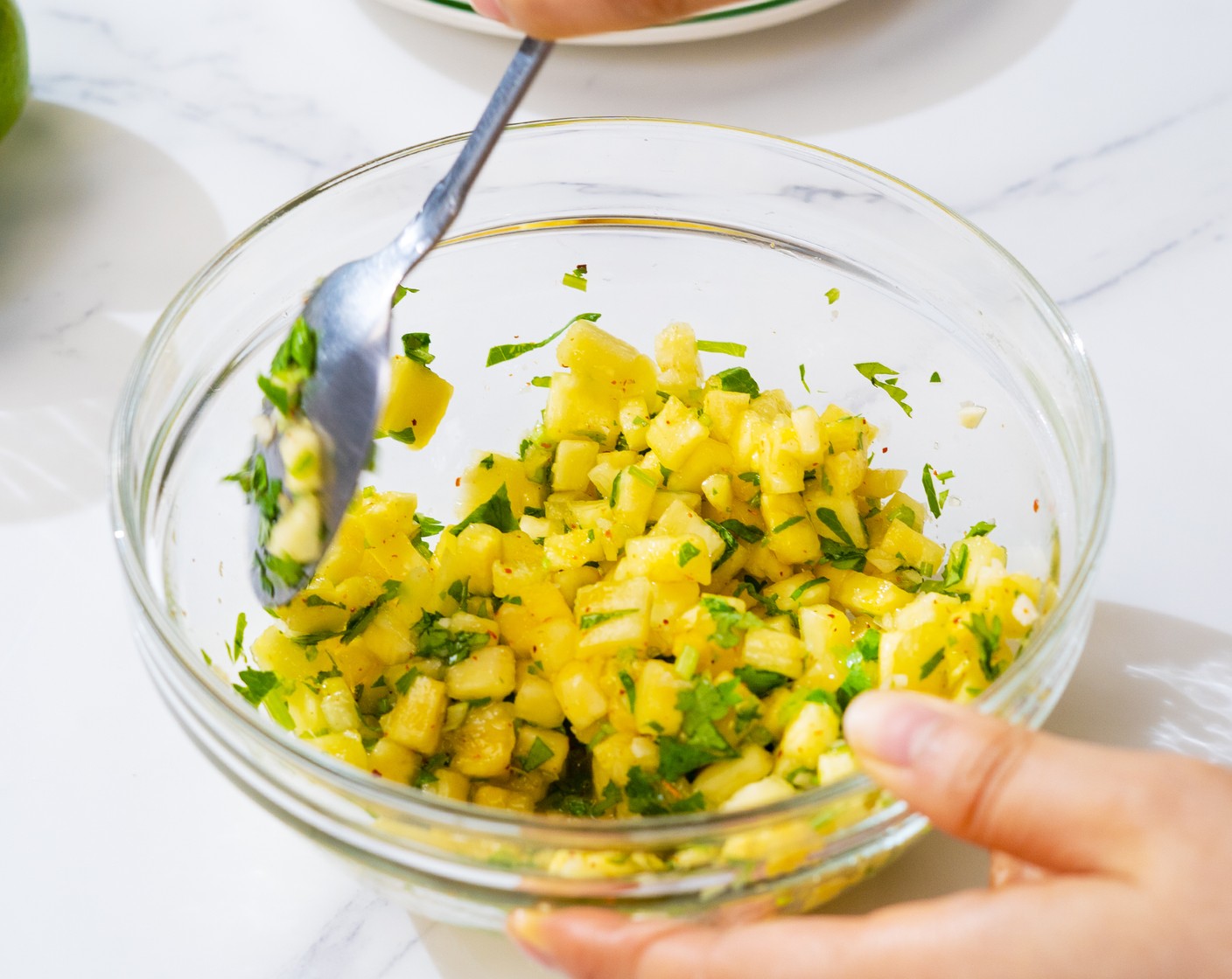 step 1 In a mixing bowl, add Fresh Cilantro (1 bunch), Garlic (1 clove), Pineapple (1 cup), Lime (1/2), Brown Sugar (1 tsp), Fish Sauce (1/2 tsp), and Tajin (1/4 tsp). Mix well, then cover and keep in the fridge.