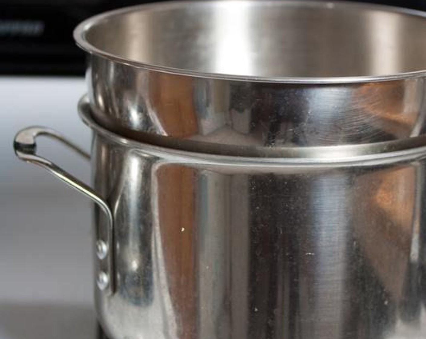 step 1 Set up a double boiler on a burner over medium low heat (a heat safe bowl over a saucepan filled with about 1 inch of water).