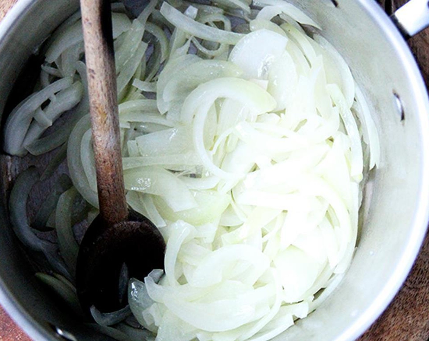 step 1 Sauté Onions (2) in Butter (1/4 cup) over medium heat for 15 minutes, or until tender and just beginning to turn color.