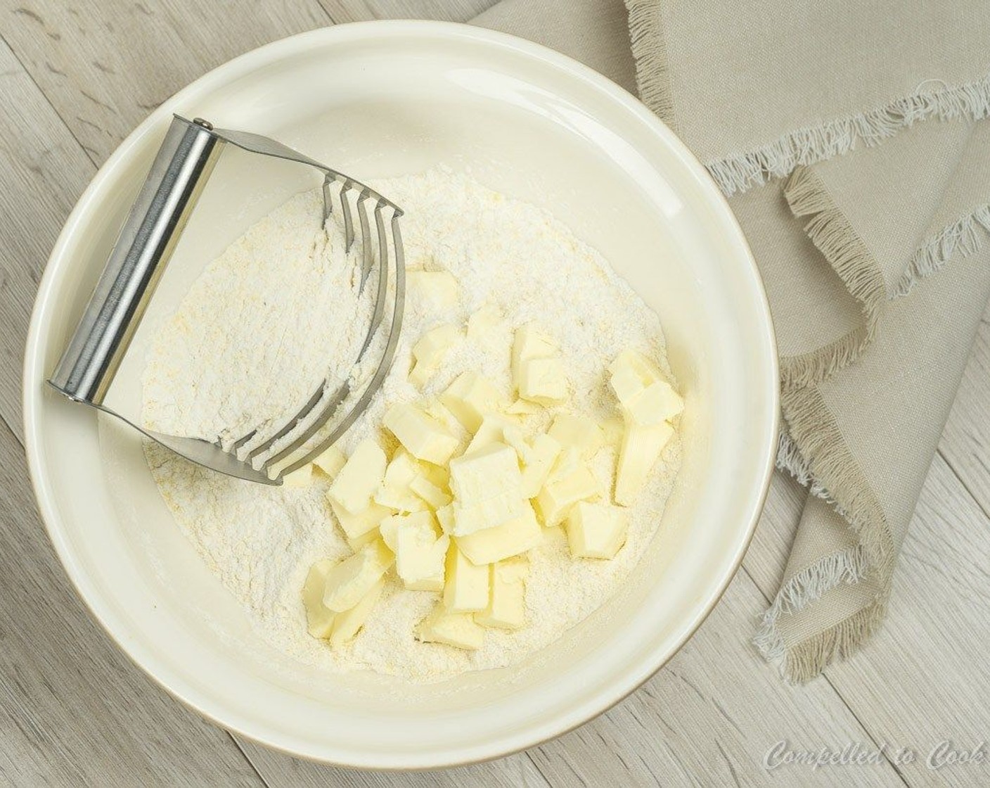 step 3 Add Unsalted Butter (1/2 cup) and using a pastry cutter, cut butter into dry ingredients until pea-sized and evenly distributed.