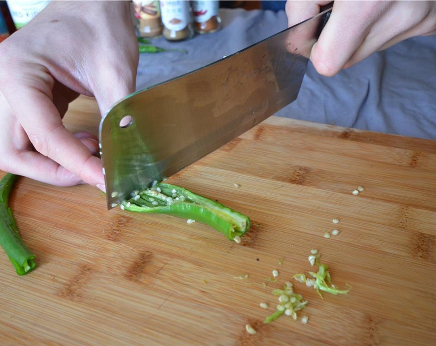 step 1 Deseed the Chili Peppers (2) and chop them.