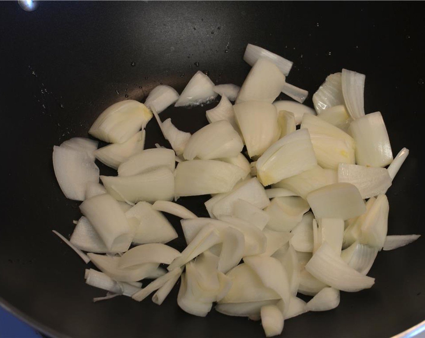 step 9 Heat a little oil in a wok or frying pan on medium-high heat and saute the Onion (1) for about 2 minutes.