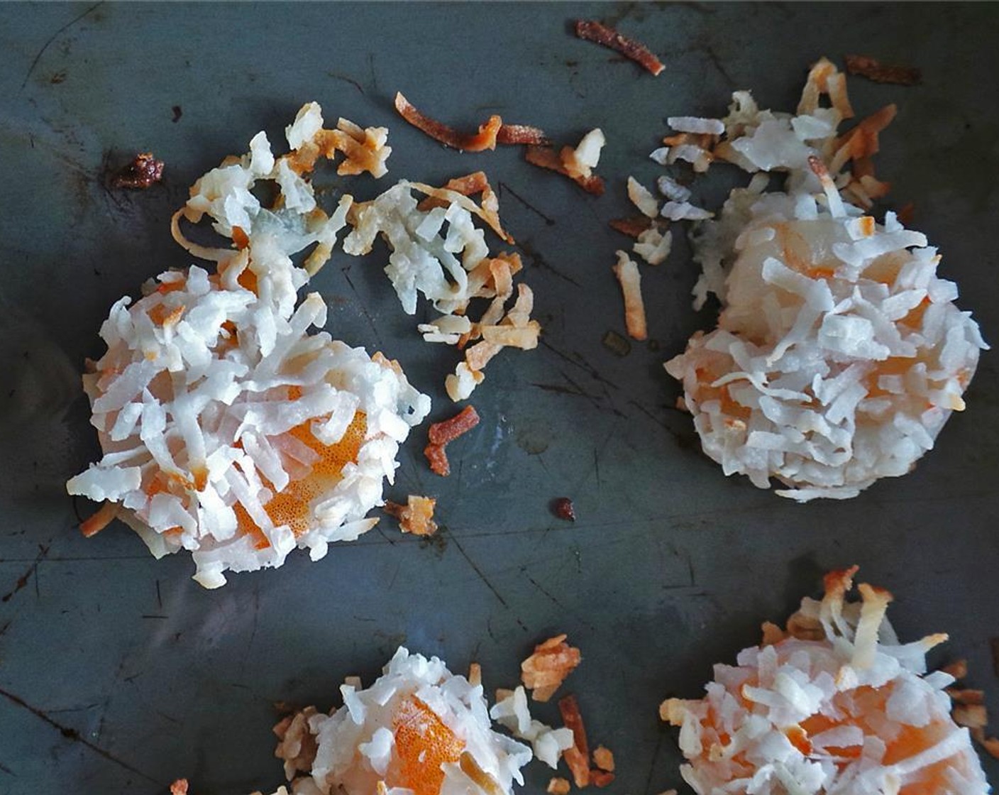 step 3 Lay out Unsweetened Shredded Coconut (1/2 cup) on a plate. Dip Shrimp (1 lb) in egg mixture, then coconut. Transfer to pan with hot oil and cook 2-3 minutes on each side until crispy and brown.