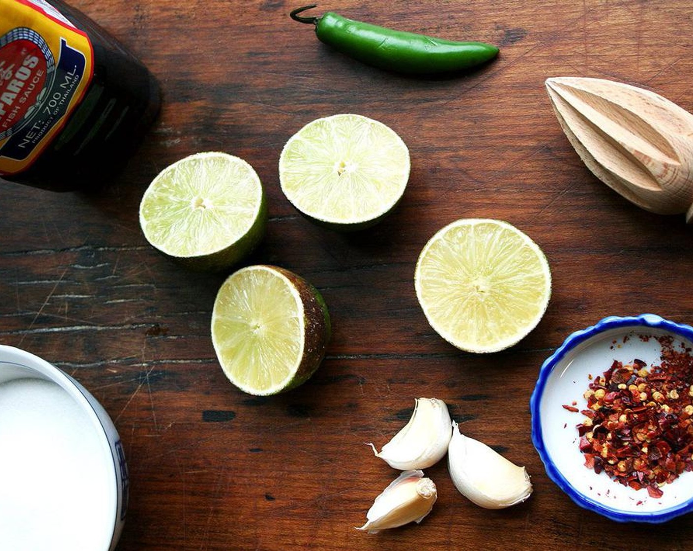 step 2 Meanwhile make the nuoc cham: In a medium bowl, whisk together the Granulated Sugar (1/4 cup), Fish Sauce (1/3 cup), and juice from Limes (3 1/2) until the sugar is completely dissolved.