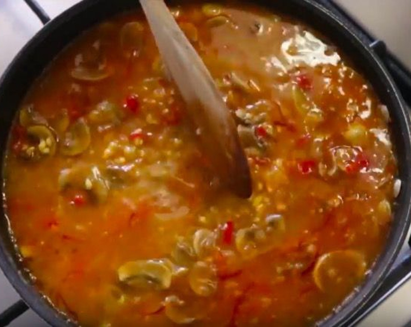 step 9 Add Vegetable Broth (2 cups) and gently distribute the rice with a wooden spoon. Cook between 8 to 10 minutes, stirring occasionally, until there is very little broth left.