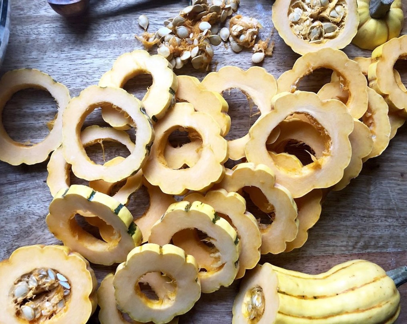 step 2 Slice the Delicata Squash (2) in rings about 1/4 inch thick. Remove the seeds and loose fiber.