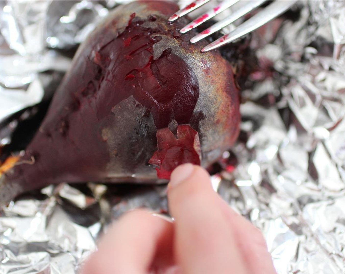 step 7 After the beets have cooled enough to handle, remove the skins. When the beets are fully cooked the skins should peel off relatively easily.