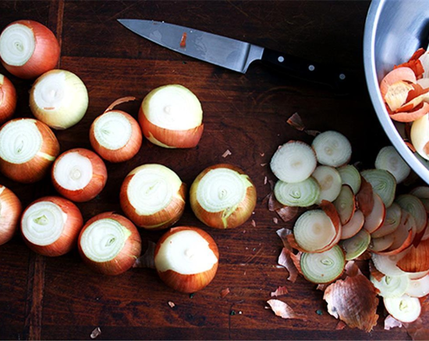 step 1 Prepare two large bowls — one for the scraps and one for the Onions (18 cups). A bench scraper is nice to have close by, too. Start by trimming off the ends of each onion, collecting scraps in one of the bowls as you go.