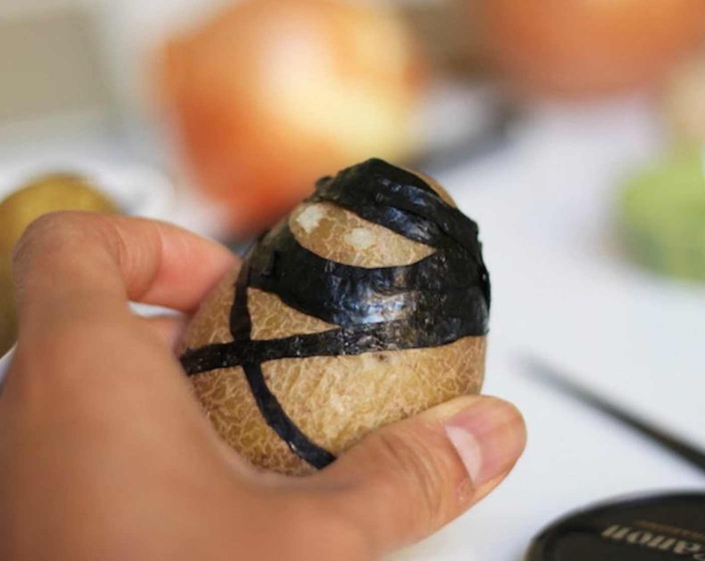 step 3 Wet the seaweed strings with water and wrap the strings around the boiled potato.