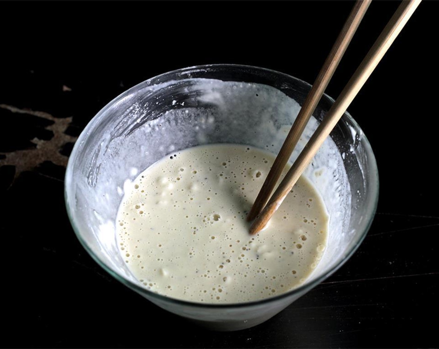 step 10 It’s fine if there are small lumps of flour here and there. Take however many nuggets you’re frying out of the freezer. Add a few pieces of frozen nuggets in the batter to keep it cold.